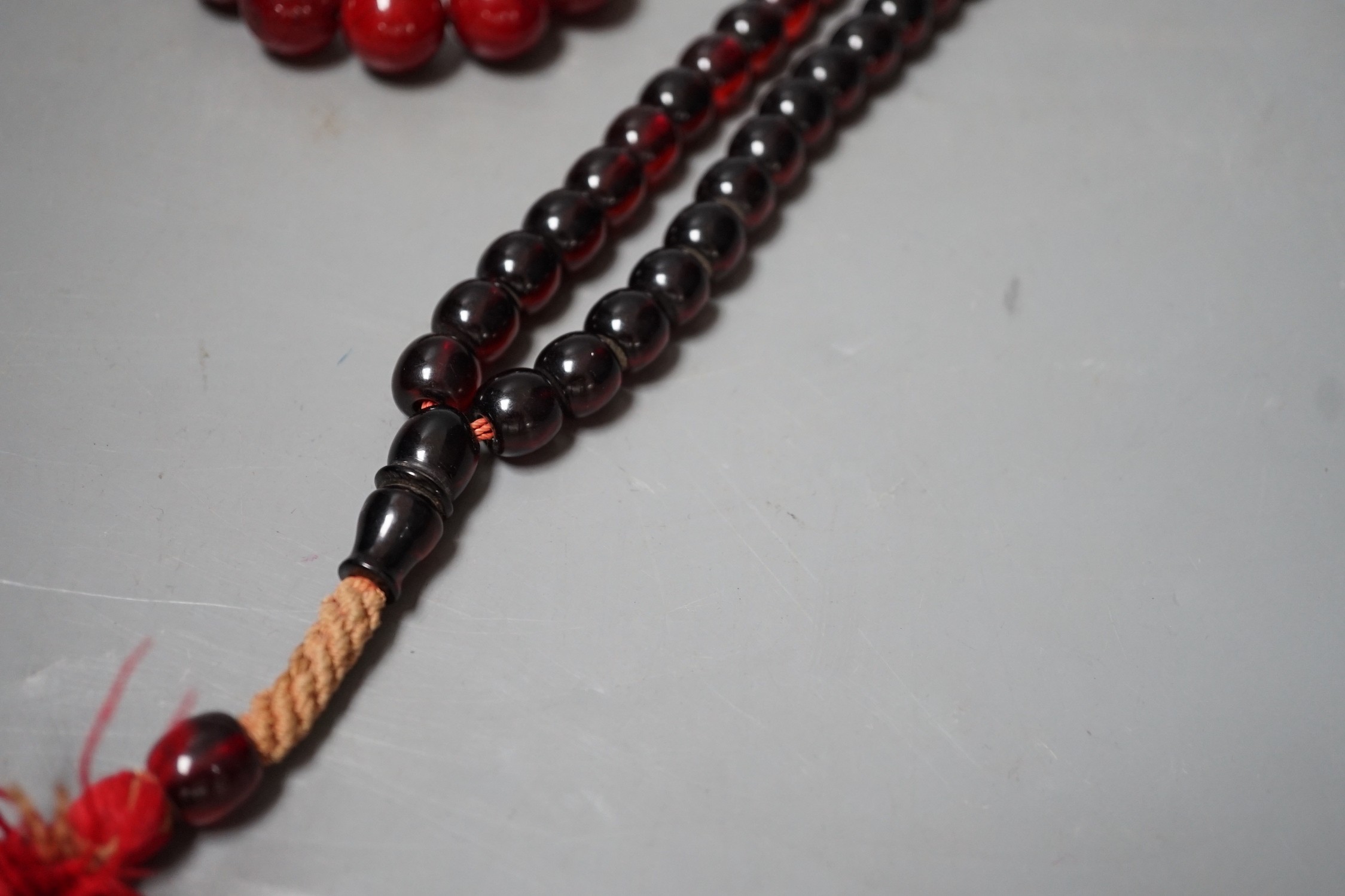 Two simulated Cherry Amber beads